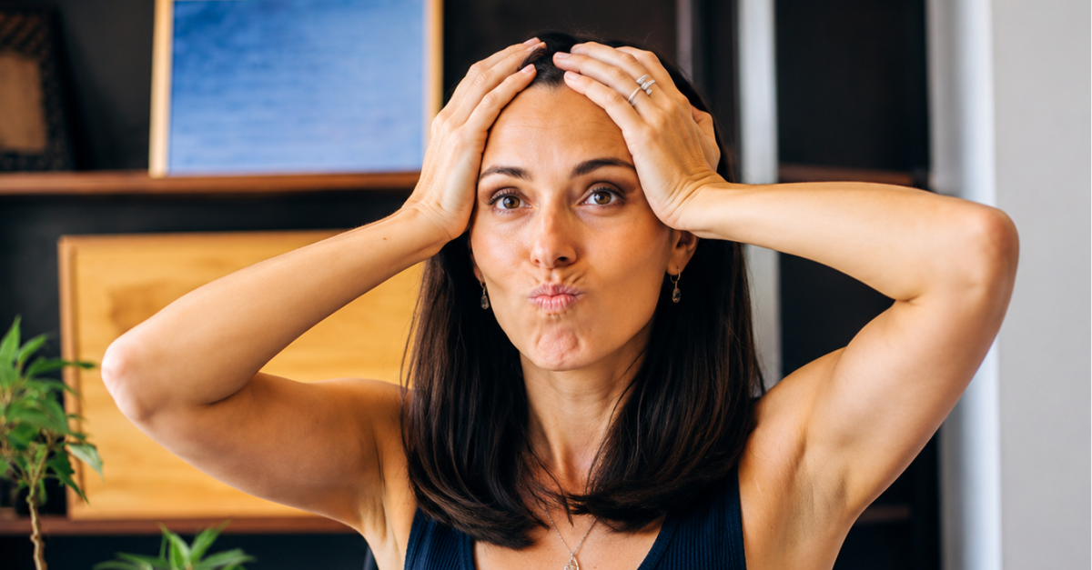 Stressed Woman at Hotel Desk