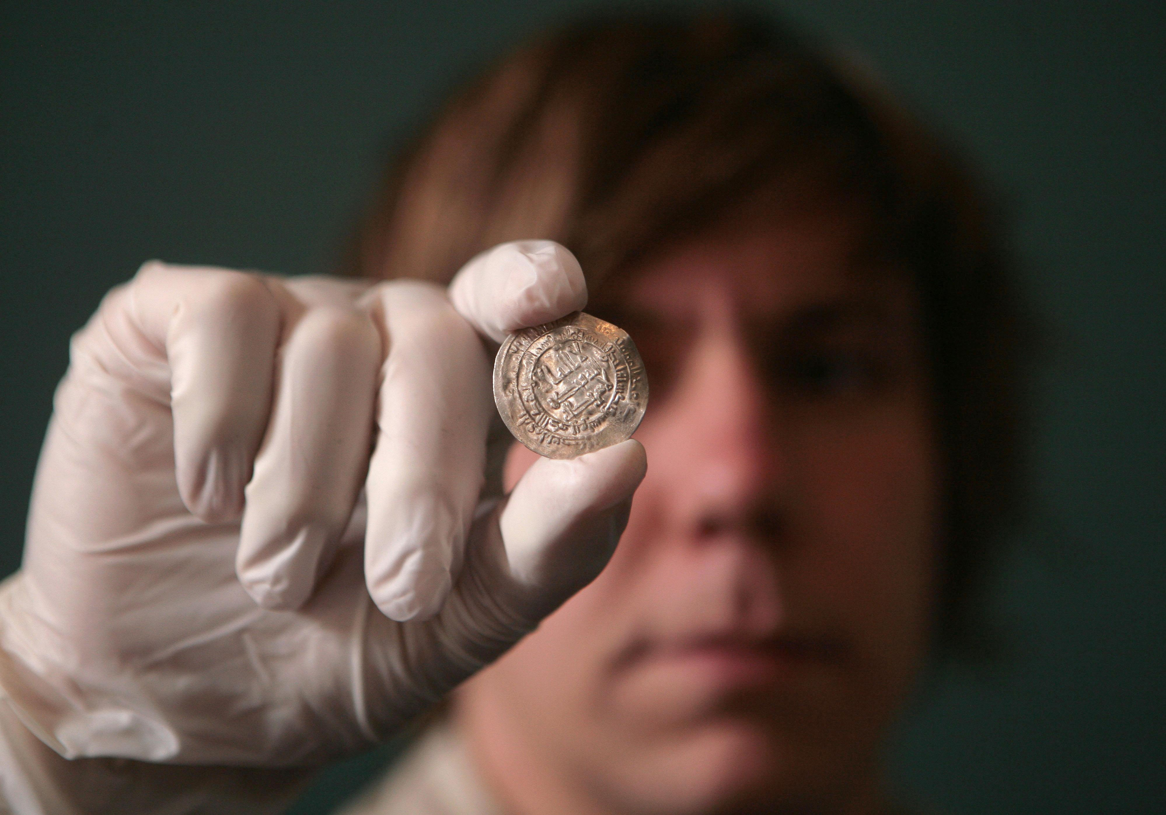A silver coin, one of a number of newly conserved objects from a major Viking treasure hoard, going on display at The British Museum, London and the Yorkshire Museum, York.