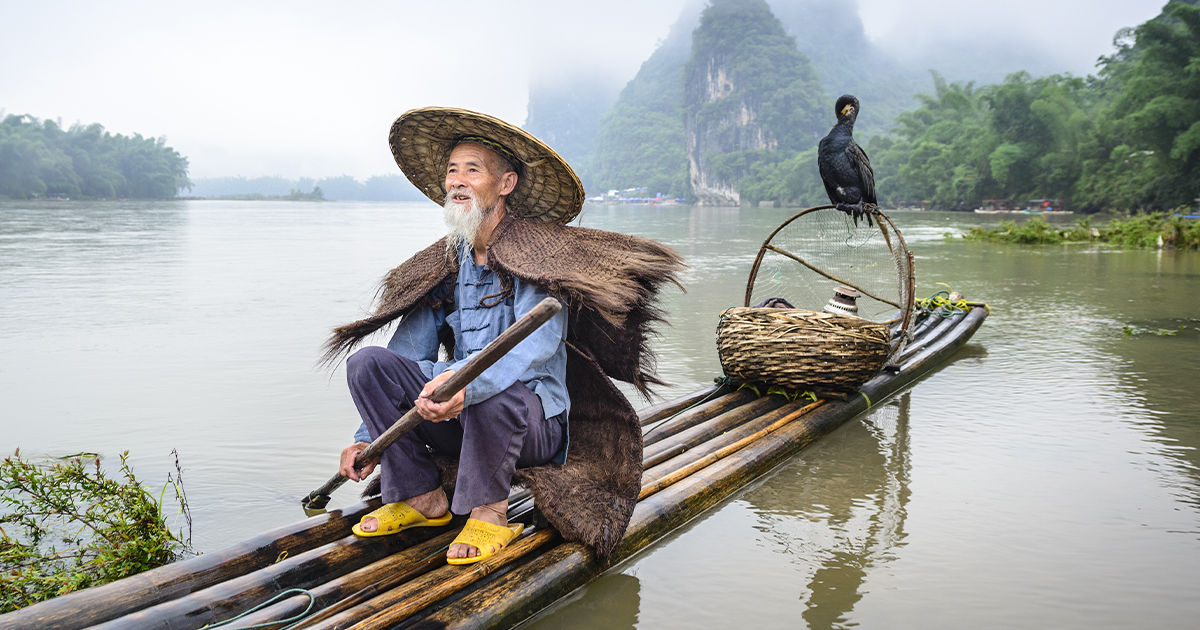 Photos Of The River Hunters Who Fish Using Trained Birds