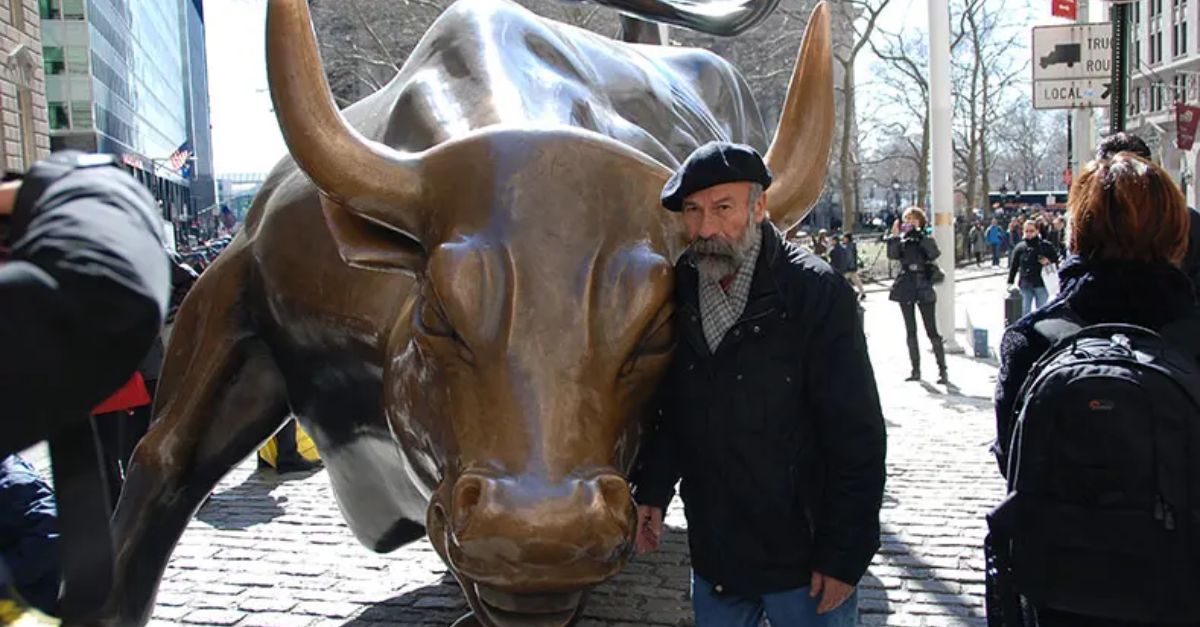 man and charging bull