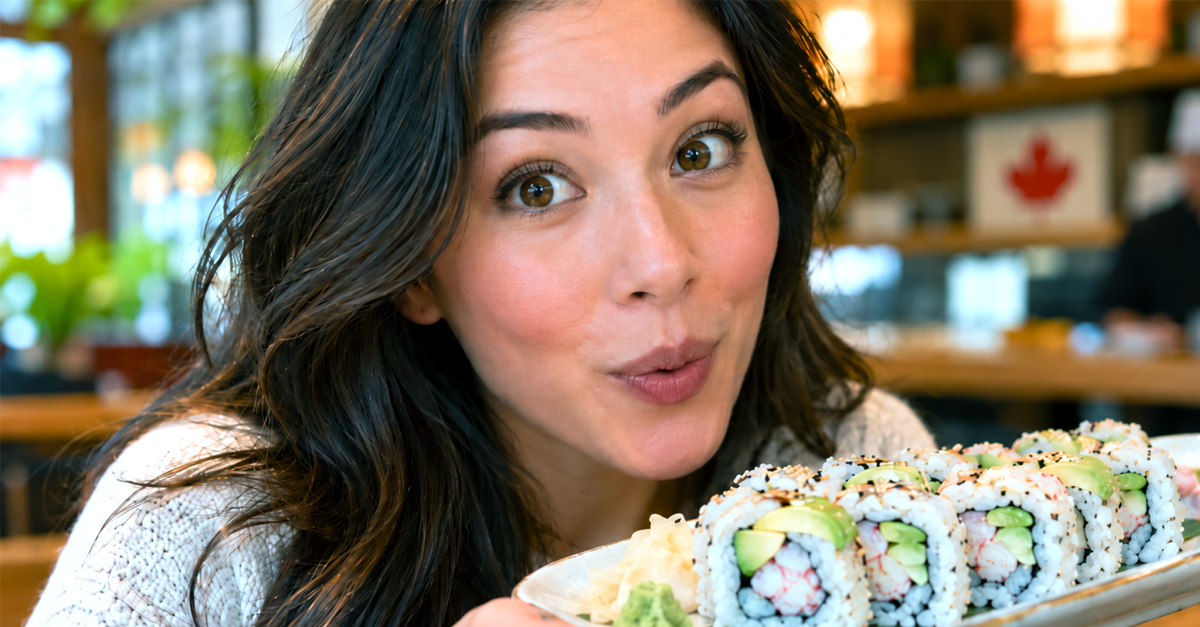 Close up of a woman excited with a california role, small canada maple leaf in background