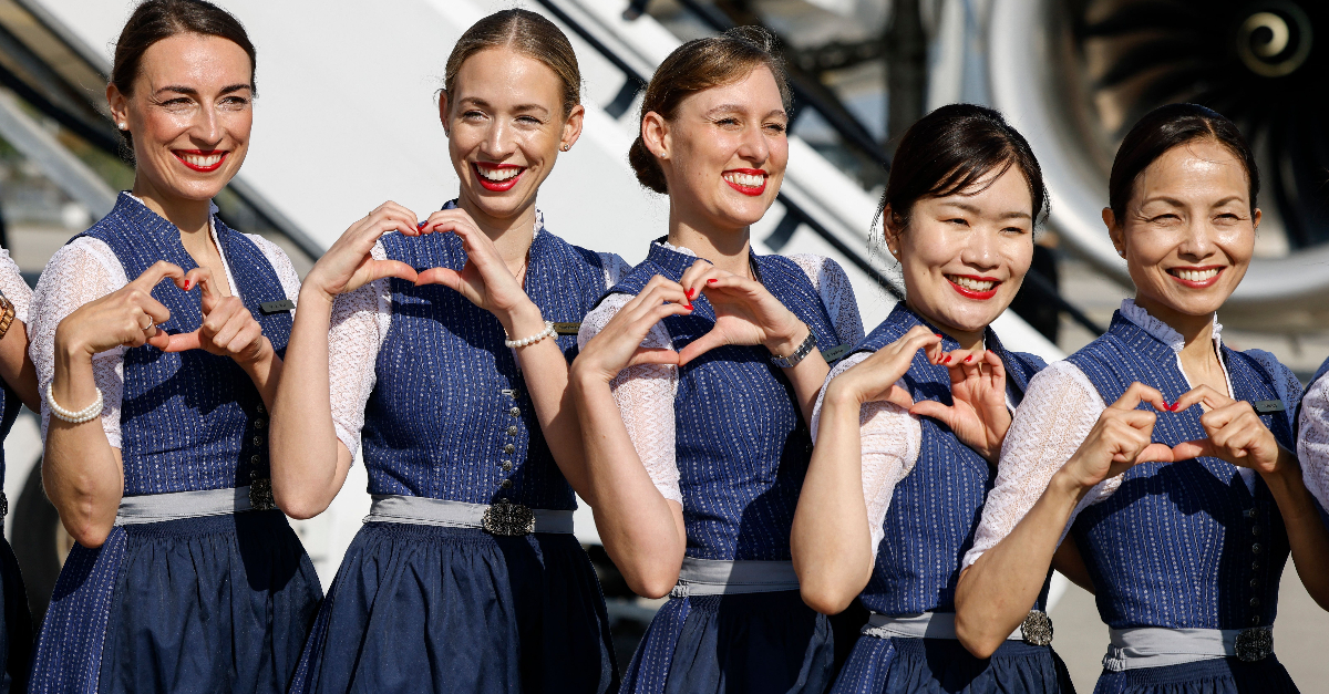 Lufthansa crew members dressed in traditional Bavarian Lederhosen and Dirndl clothes