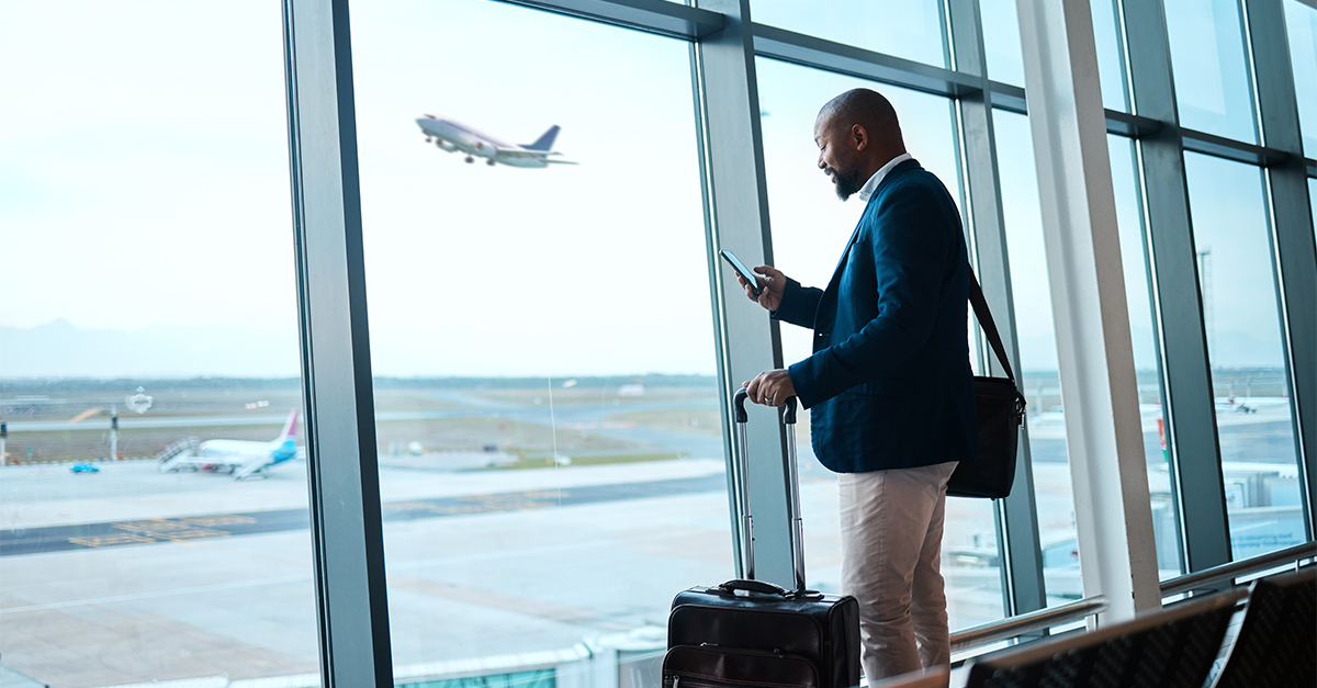 Black man with phone, airport window and plane taking off, checking flight schedule terminal for business trip. Technology, travel and businessman reading international travel restrictions app online