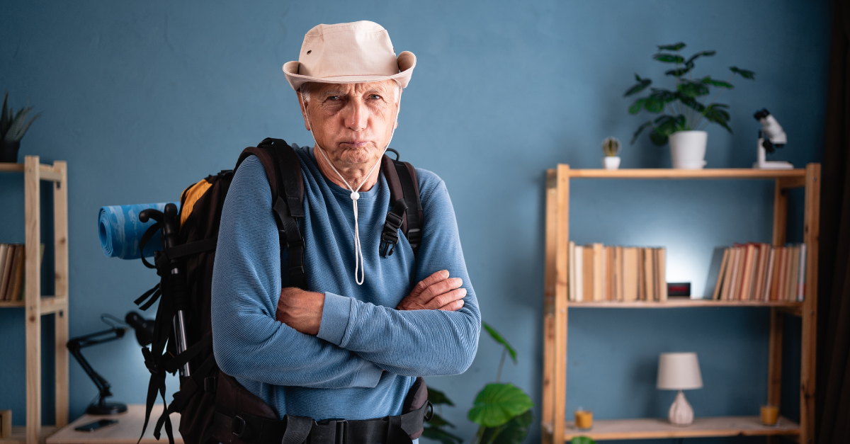 Elderly traveler with backpack upset offended