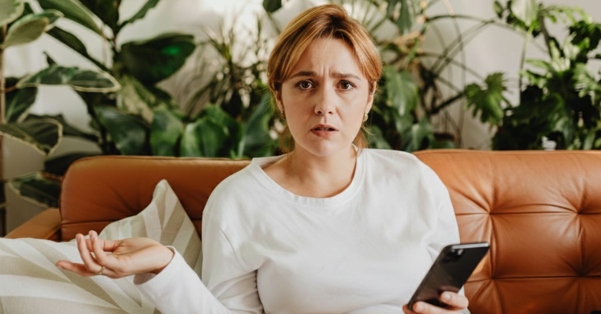 Woman holding her phone