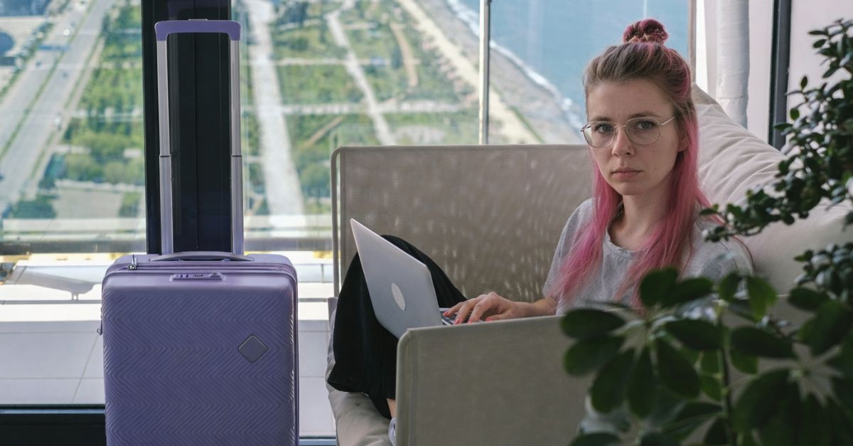 Woman using laptop at hotel