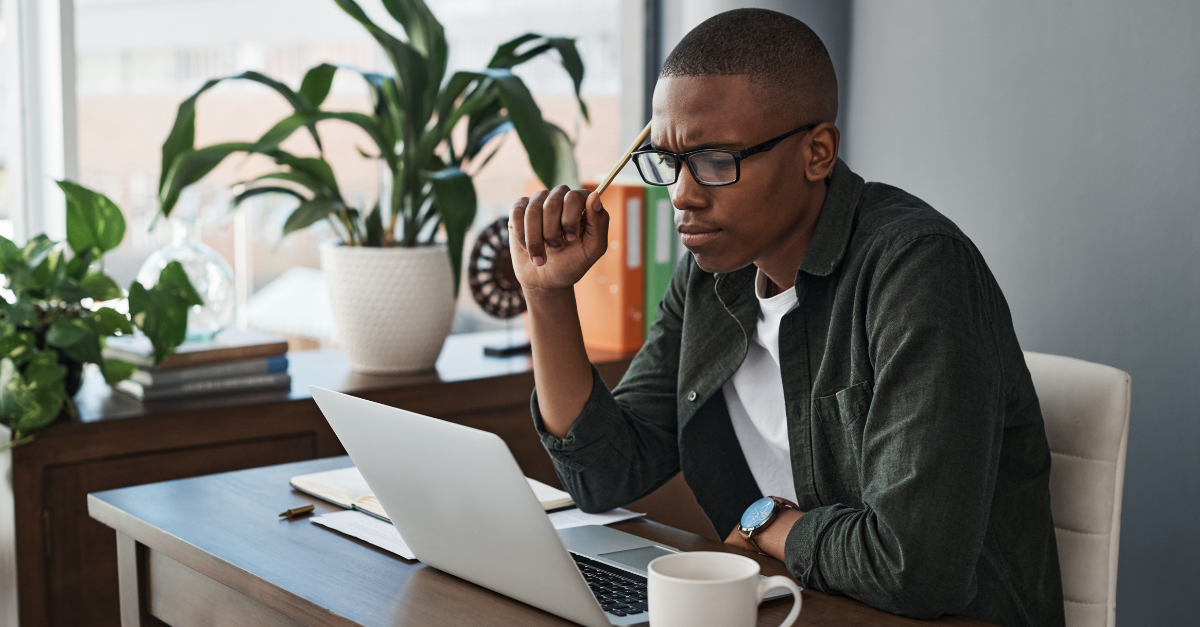 Laptop, idea and black man with doubt