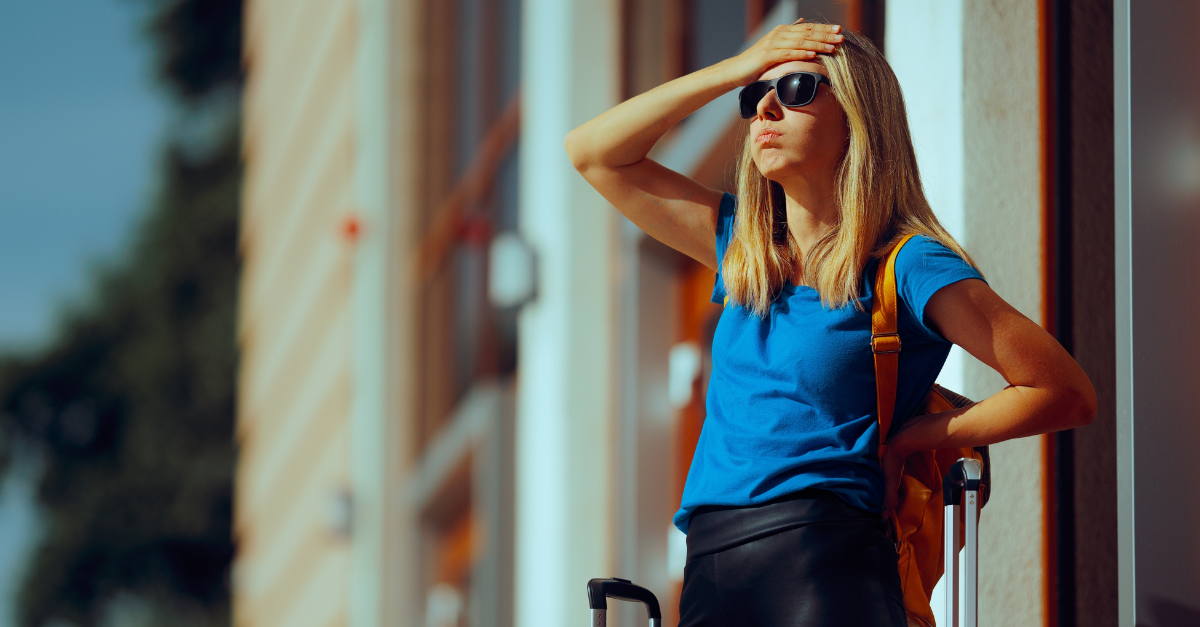 Stressed Tourist Standing in an Airport Losing Luggage