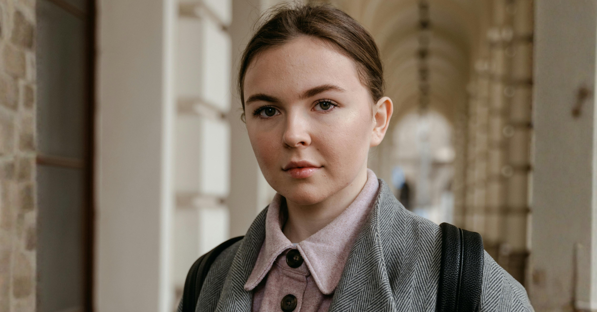 a-woman-holding-books