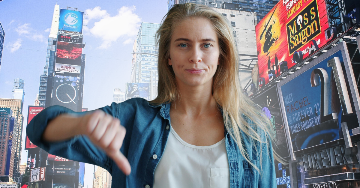 young-woman-showing-thumbs-down-gesture