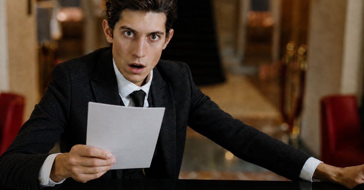 Shocked Man Holding A Document