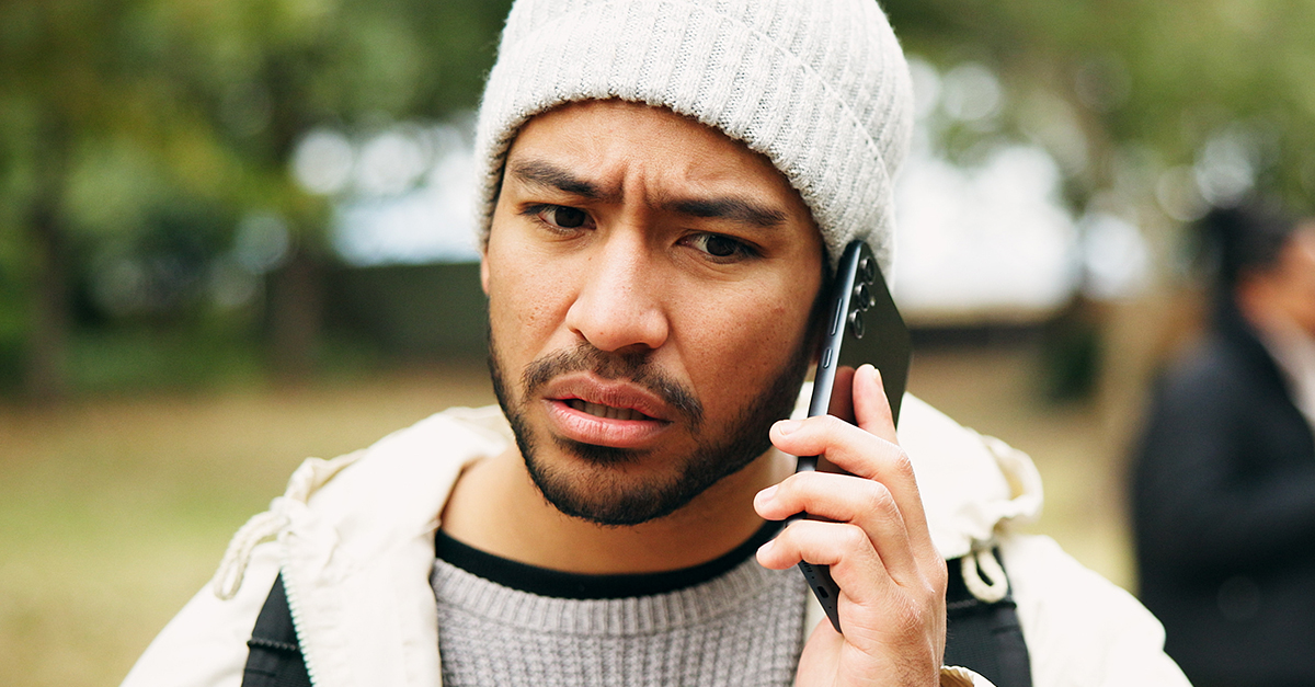 Worried man on the phone.