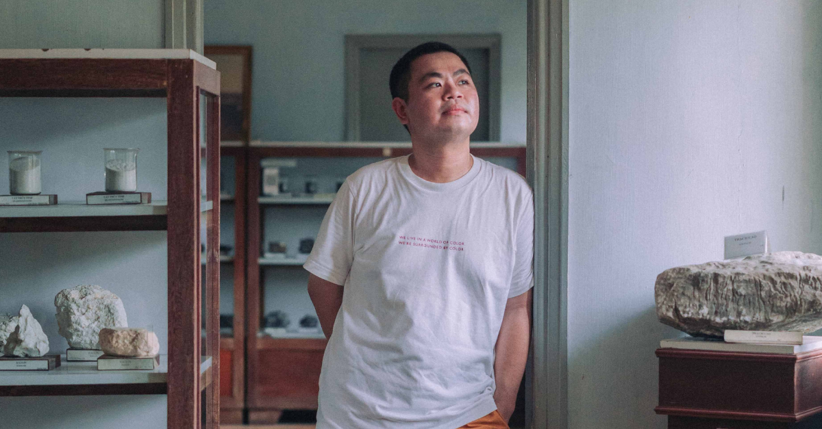 a-man-in-a-t-shirt-and-shorts-standing-in-the-doorway