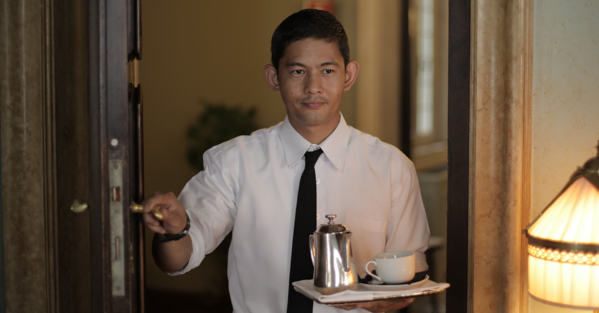 hotel-servant-carrying-coffee-to-guest