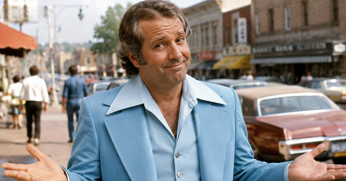 man in 1970s wearing leisure suit looking at camera
