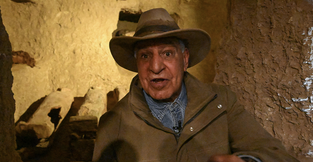 Egyptian archaeologist Zahi Hawass talks to reporters in front of burial shafts and wooden coffins from the 17th dynasty, during a media event to announce new discoveries by the Egyptian archaeological mission he leads at Queen Hatshepsut's Valley Temple