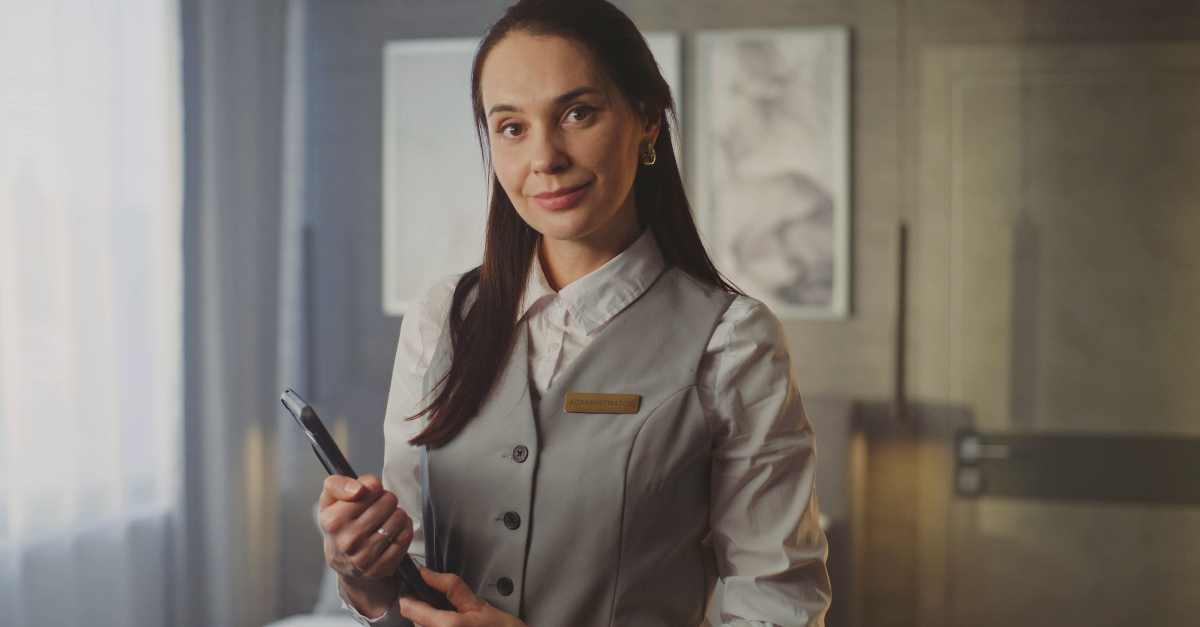 Smiling Female Hotel Service Professional in Uniform