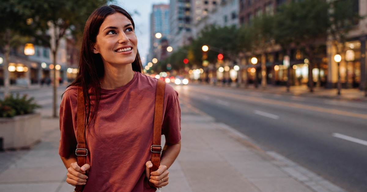 Smiling traveler walking through an American city