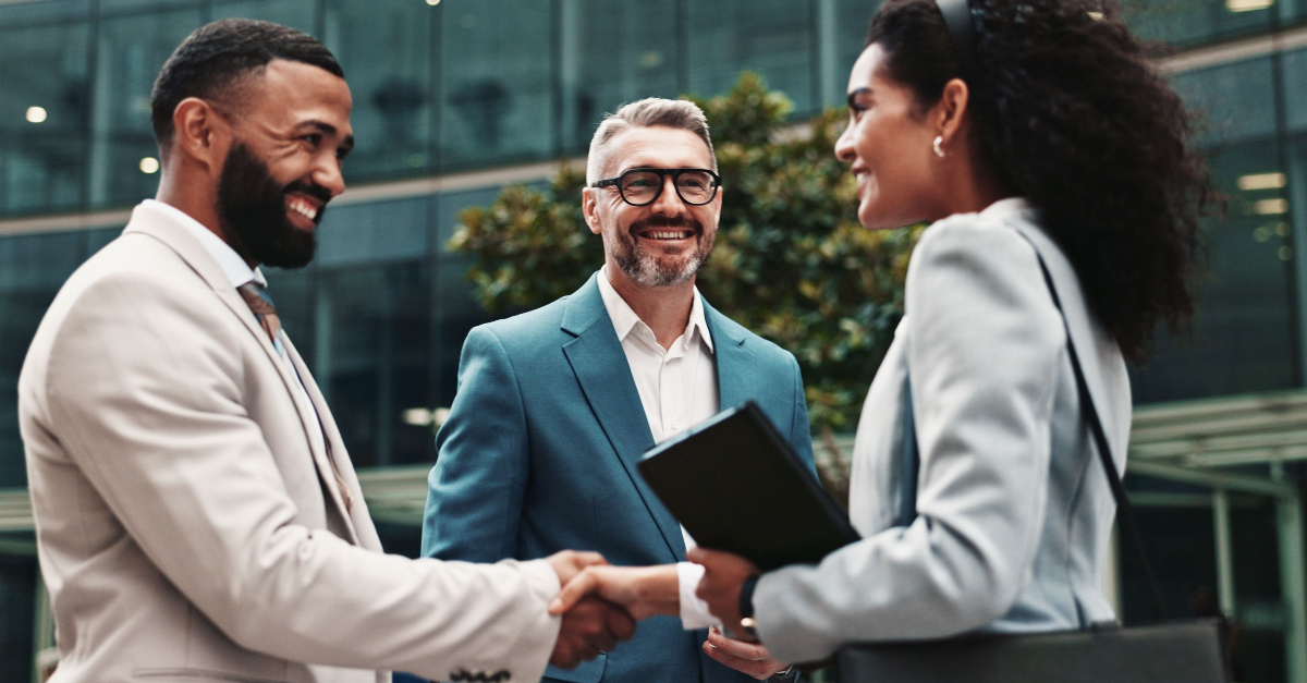 City, business people and smile with handshake