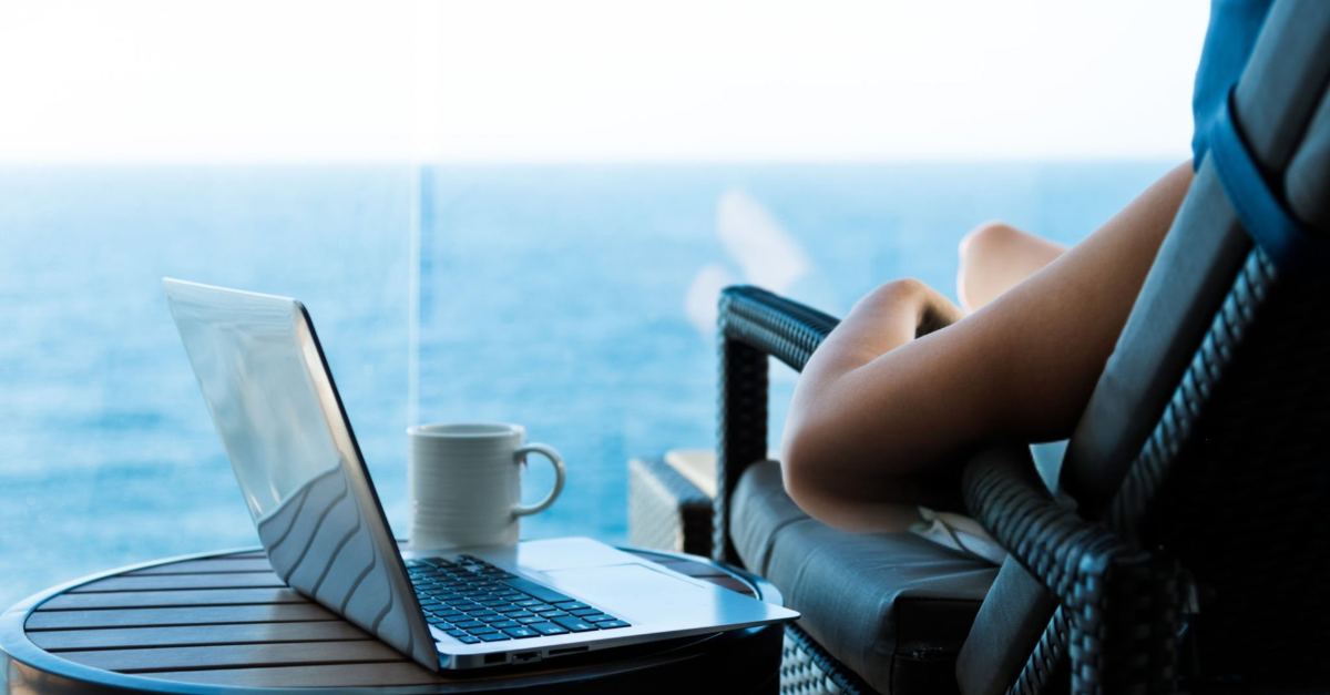Woman working with a laptop on cruise ship.