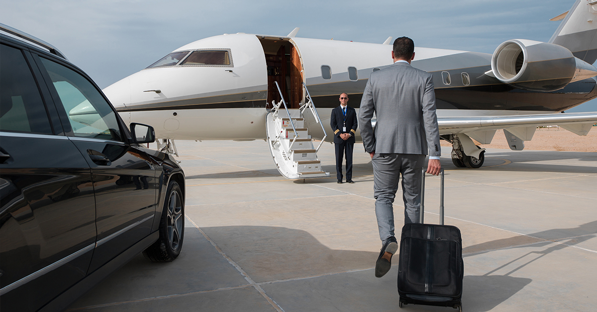 Business man boarding a plane.