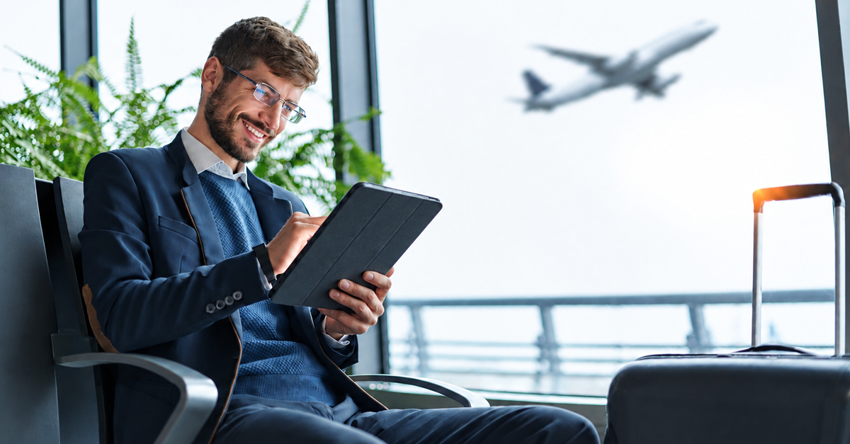 business man using a digital tablet during a business trip.