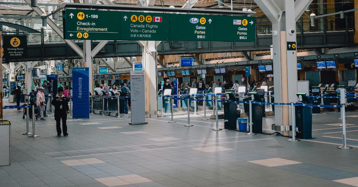a group of people standing around a terminal