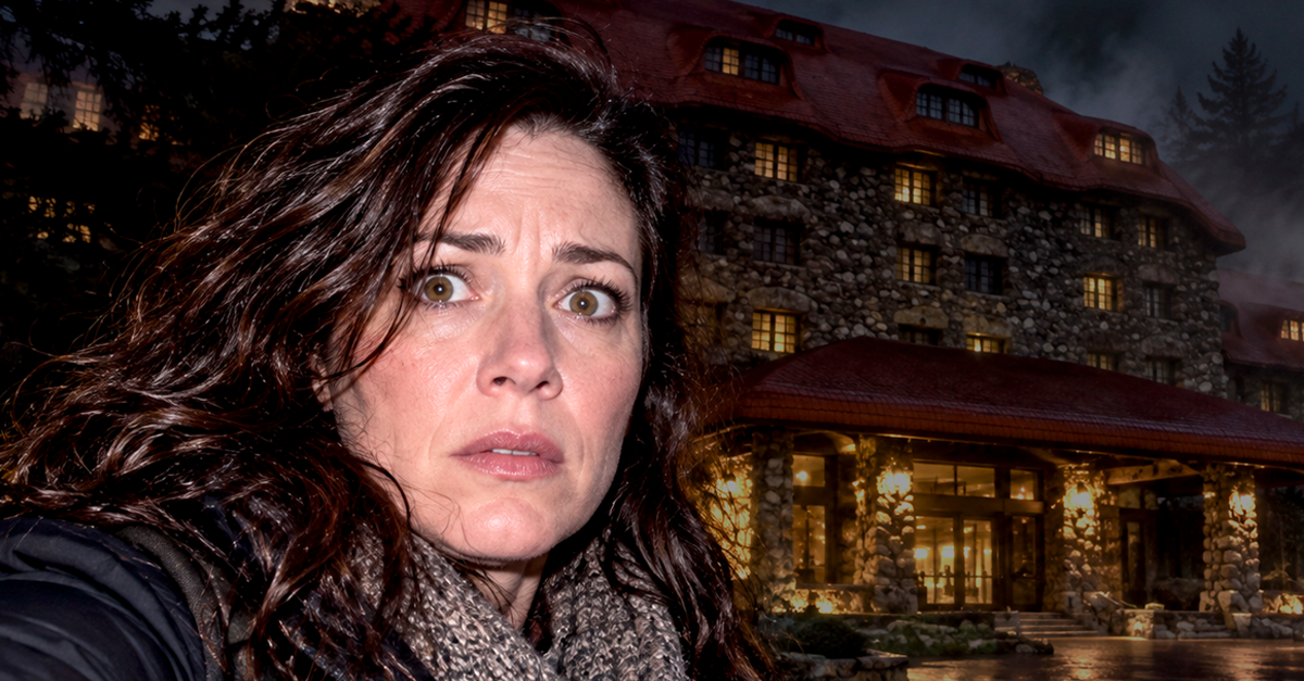 Nervous woman at night in front of the Omni Grove Park Inn in North Carolina